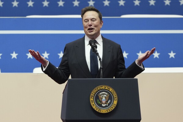 Elon Musk speaks at an indoor Presidential Inauguration parade event in Washington, Jan. 20, 2025. (AP Photo/Matt Rourke, File)